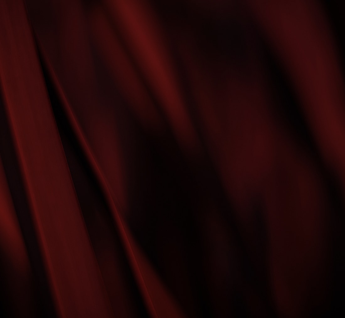 Abstract red fabric texture with soft folds.