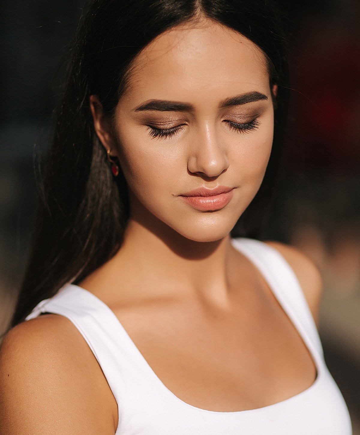 Young woman with closed eyes, natural makeup.