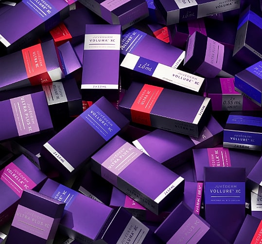 Juvederm product boxes in vibrant colors.