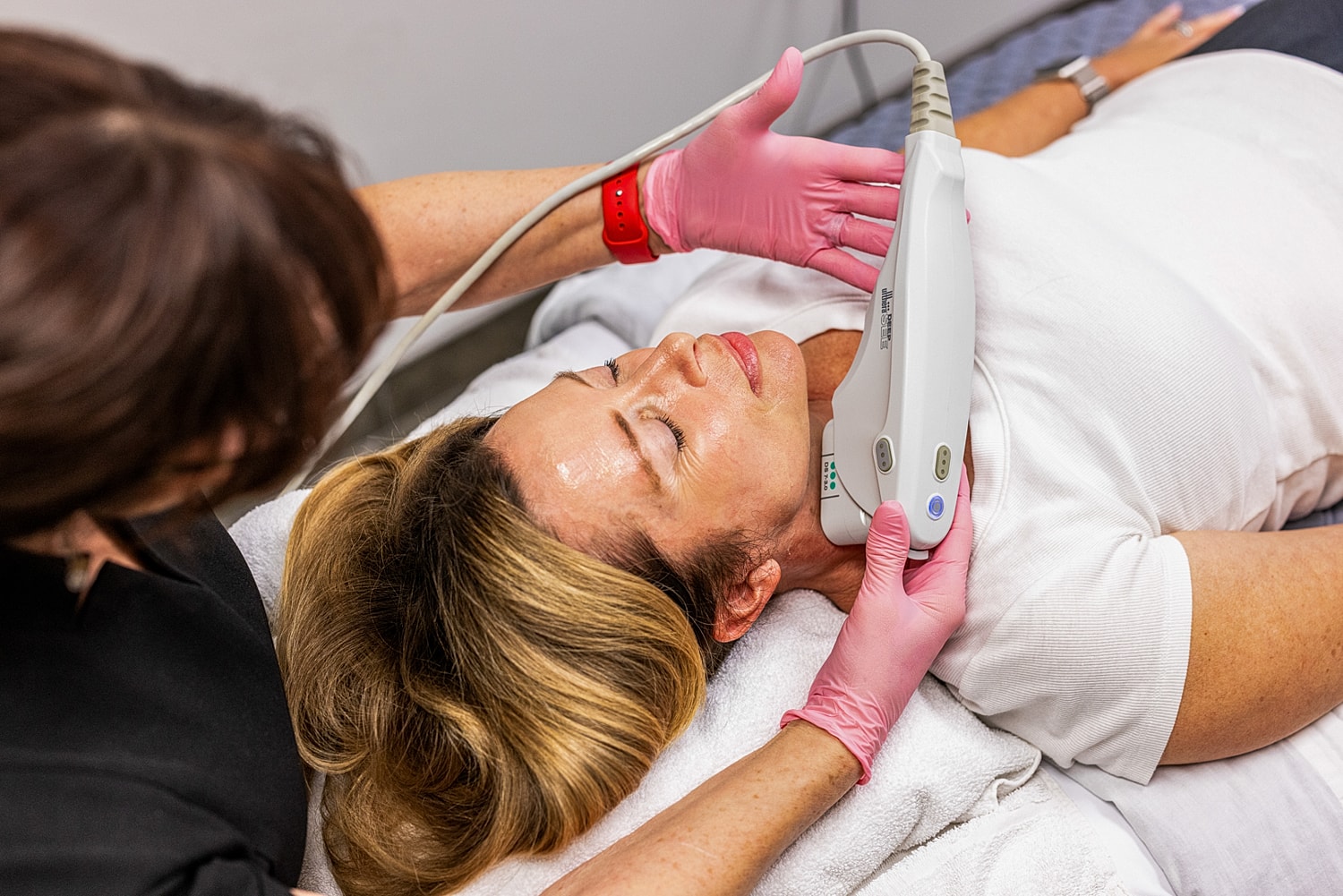 Facial treatment procedure in a spa setting.