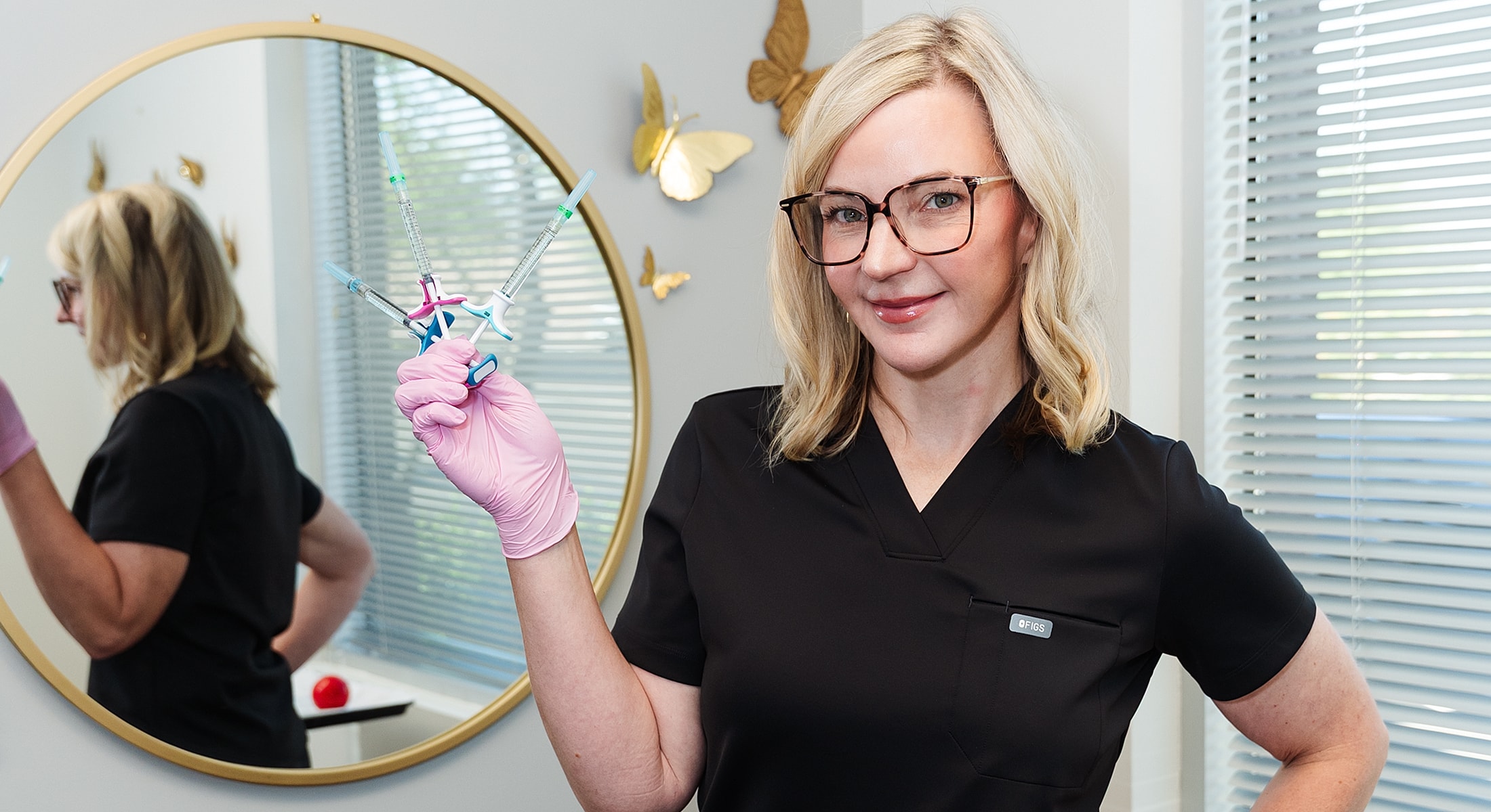 Healthcare professional with syringes in hand