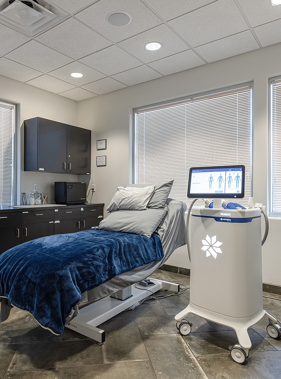 Scottsdale med spa CoolSculpting room with bed and equipment.